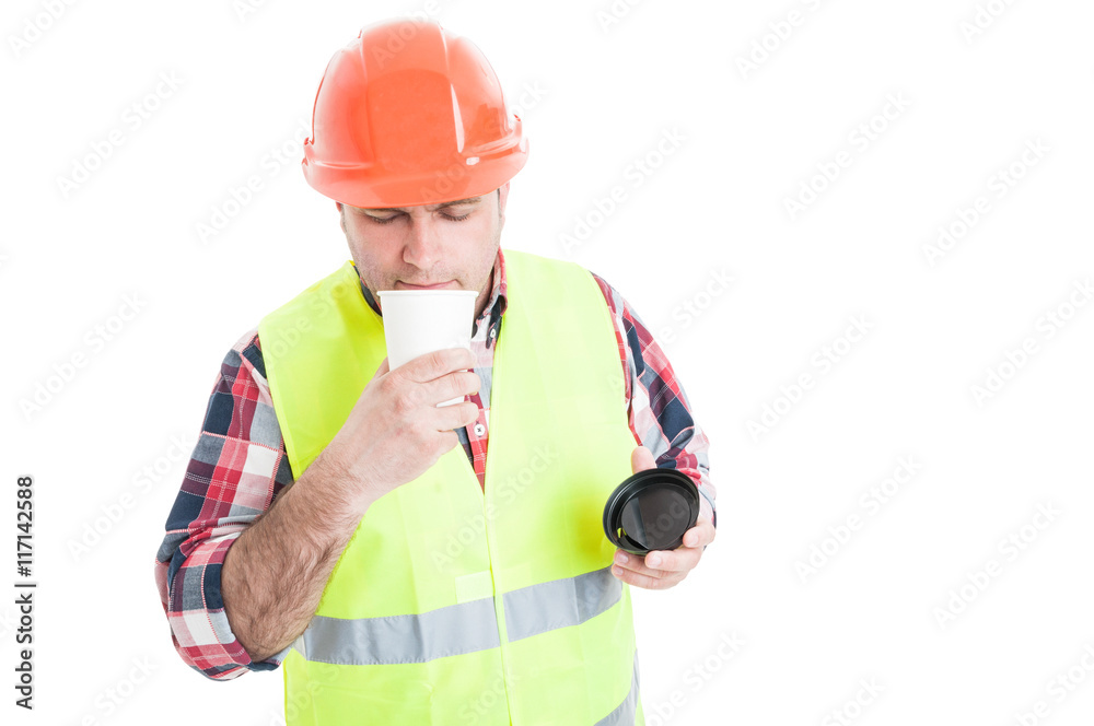 Young builder enjoying the flavor of fresh coffee Young builder enjoying the flavor of fresh coffee