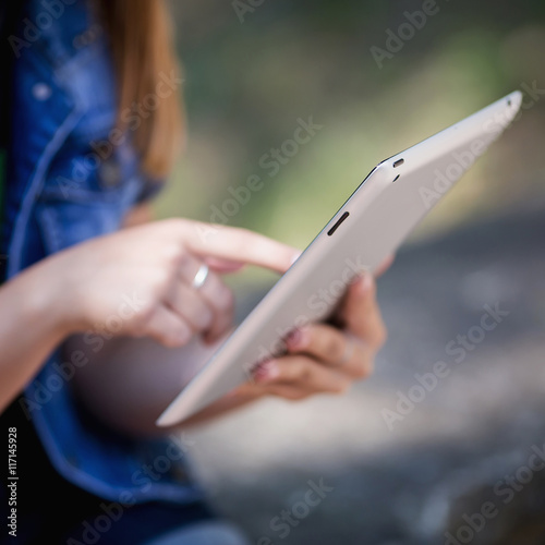 Young Woman, Girl Working With Tablet in Green Field, Park
