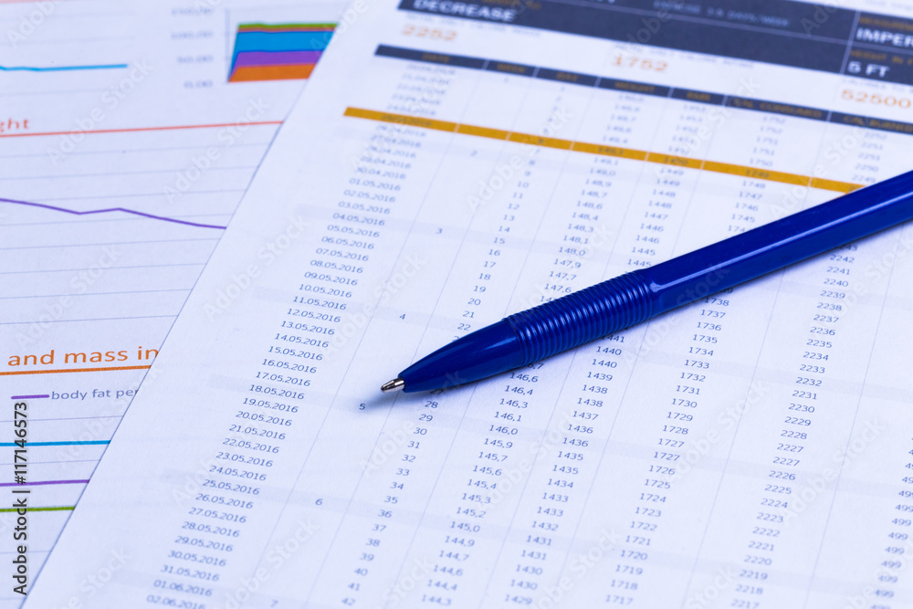 Business performance graph with ballpoint pen Business performance graph with ballpoint pen
