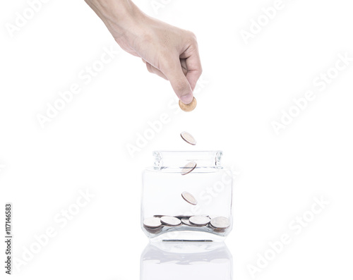  Hand saving money concept,business hand putting money coin stack growing on piggy bank. isolated on white background.