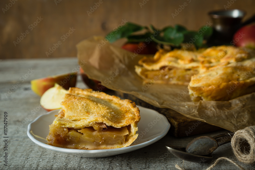 Apple pie on rustic wood background Apple pie on rustic wood background