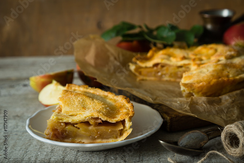 Apple pie on rustic wood background © anaumenko