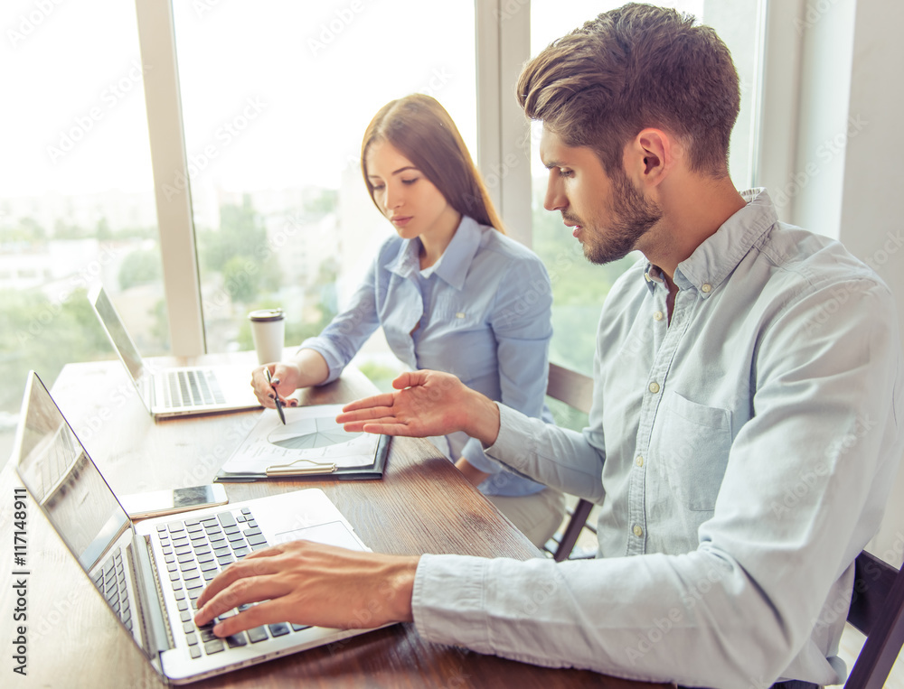 Beautiful business couple working
