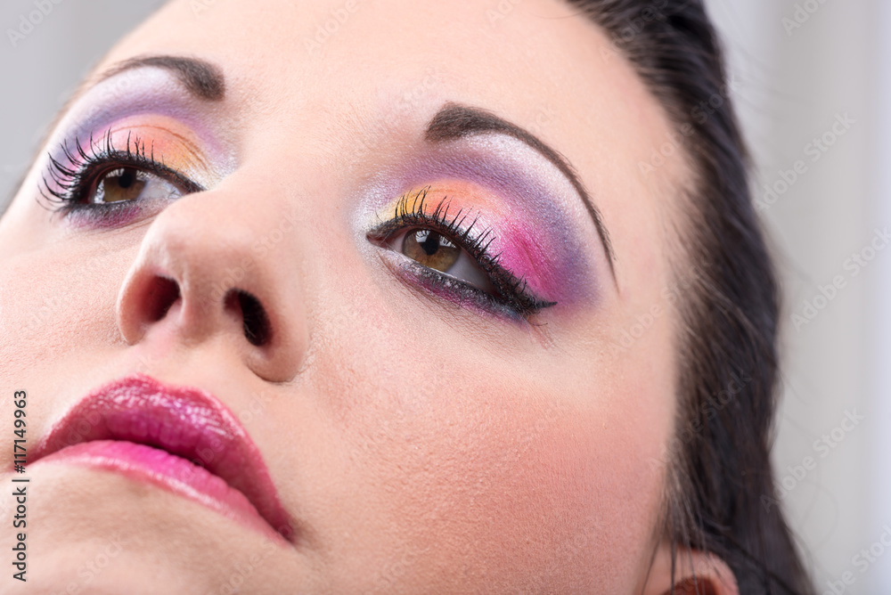 Obraz premium Young woman with fashion makeup