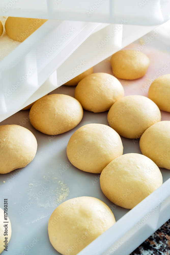 Small balls of dough with flour Small balls of dough with flour