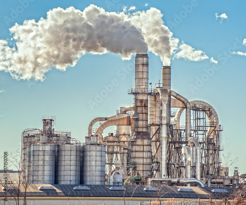 Chimneys and silos of a factory.