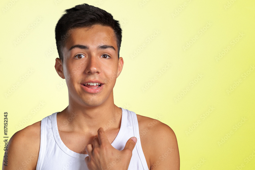 unhappy young guy pointing at himself asking you mean me? unhappy young guy pointing at himself asking you mean me?