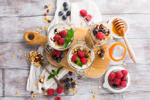 Healthy breakfast - homemade granola adn fresh berries, top view