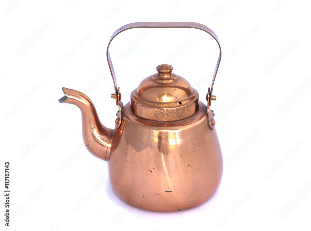 Old copper kettle on a white background