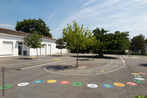 Preschool building exterior with playground on a sunny day