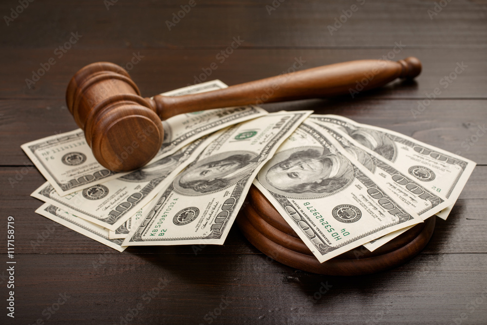 Judge gavel with dollars