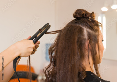 Curling hair in beauty salon