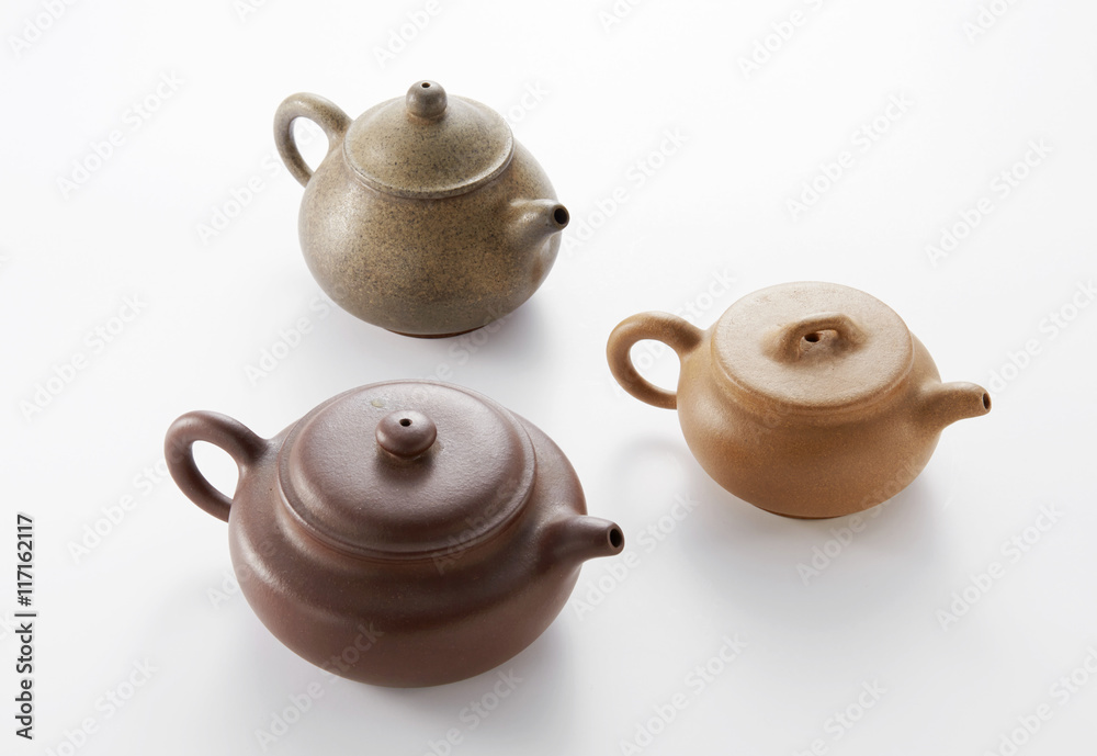 Chinese teapot and cups on white background