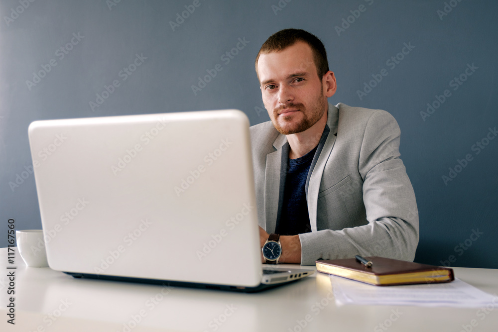 Successful businessman in jacket at work Successful businessman in jacket at work
