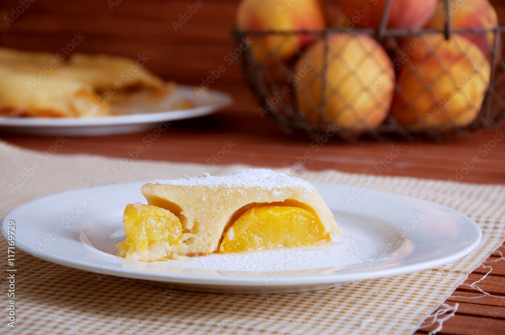 Peach caramel turnover pie sprinkled with sugar powder Peach caramel turnover pie sprinkled with sugar powder