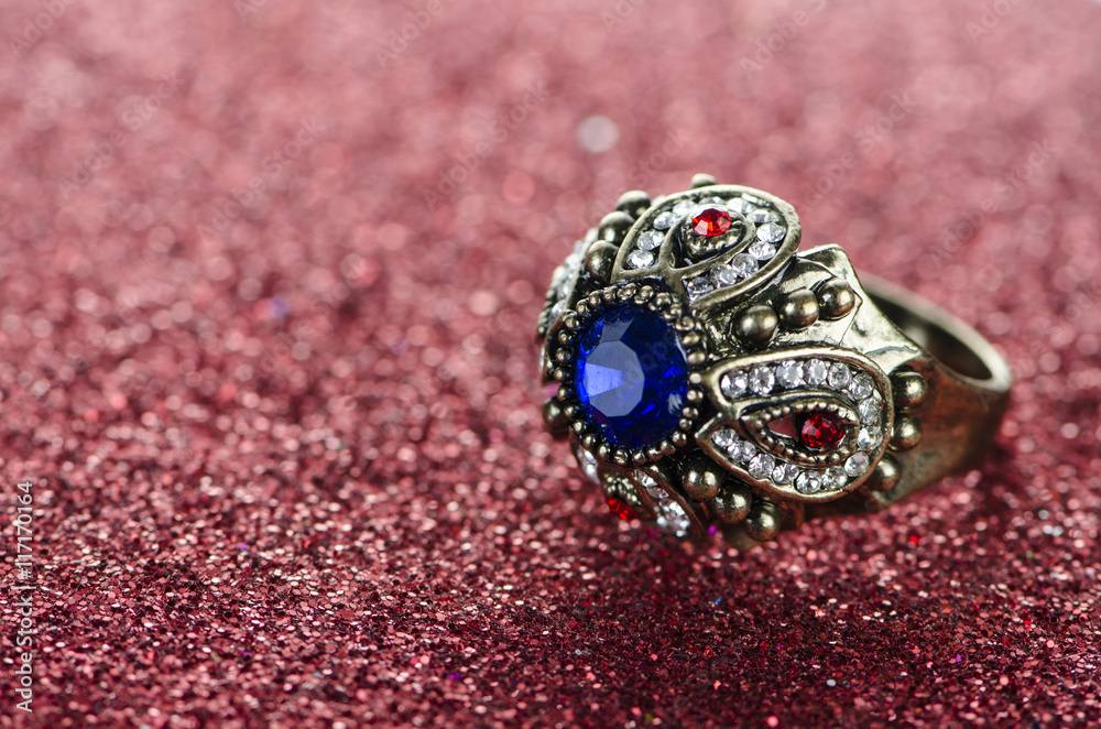 Jewellery ring against shiny background Jewellery ring against shiny background