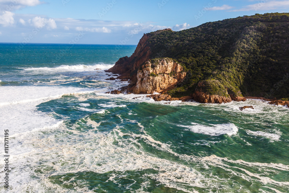 The entrance to Knysna lagoon. The western head marks the entrance from the sea and navigating the channel is dangerous at all times.