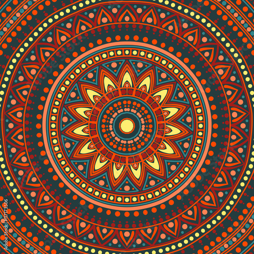 Drawing of a floral mandala in red, blue, yellow and orange colors on a dark grey background