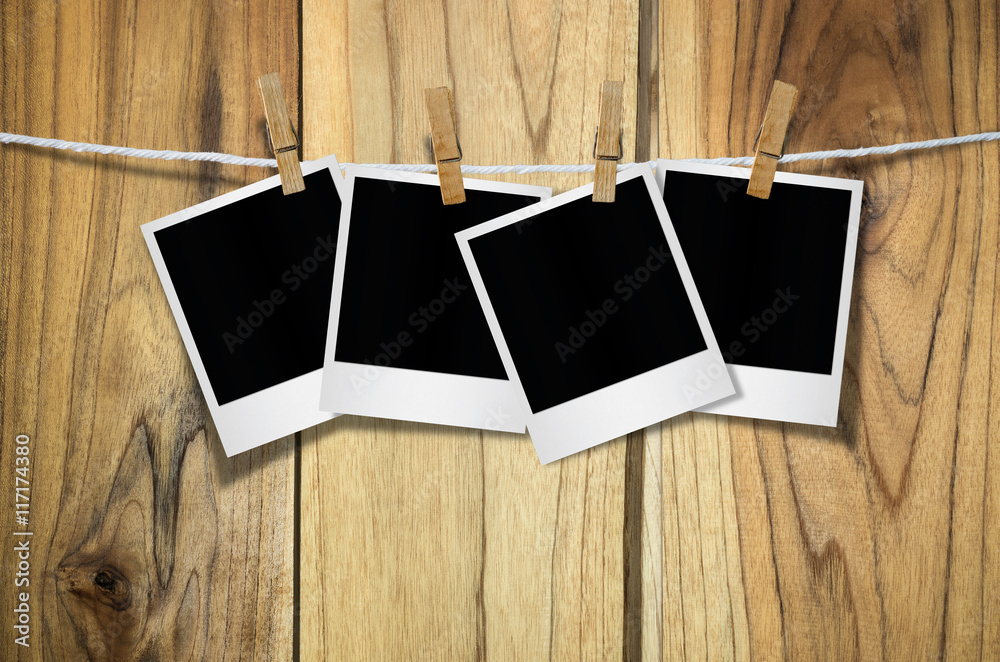 Blank photo frame with clothespin hanging. Blank photo frame with clothespin hanging.