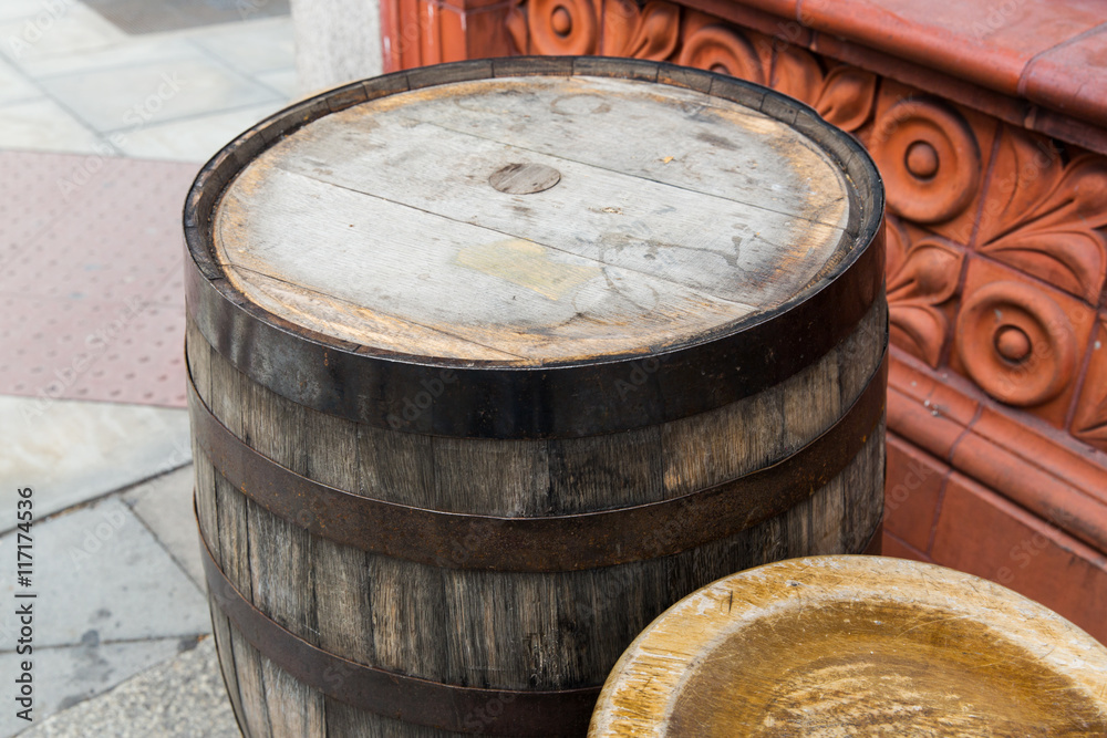 Fototapeta premium close up of old wooden barrel table outdoors