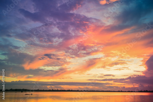 Fantastic fine orange and blue sunrise on the beach for nature background