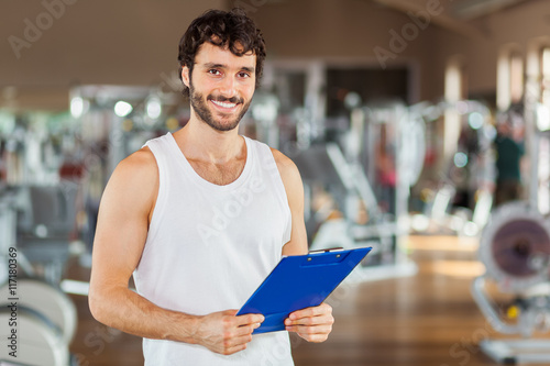 Portrait of a young man in a gym