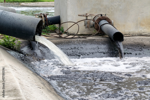 Water pollution in river because industrial not treat water before drain.
