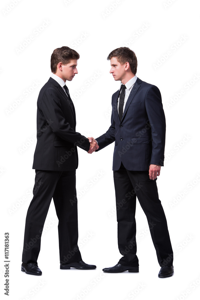 Two twin brothers handshaking isolated on white Two twin brothers handshaking isolated on white