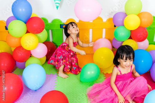 Asian Little Chinese Girls Playing with Colorful Balloons