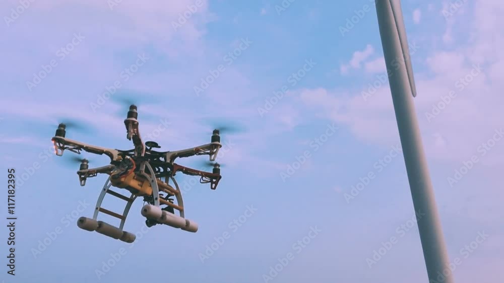 Drone flies near the wind turbine, slow motion. Drone flies near the wind turbine, slow motion.