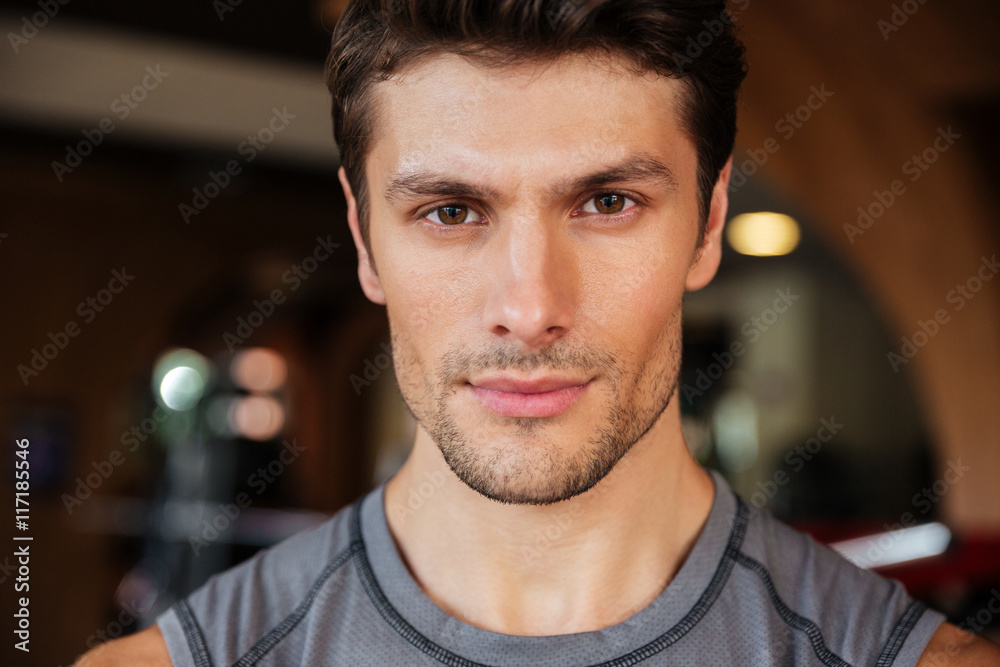 Handsome young fitness man in gym Handsome young fitness man in gym