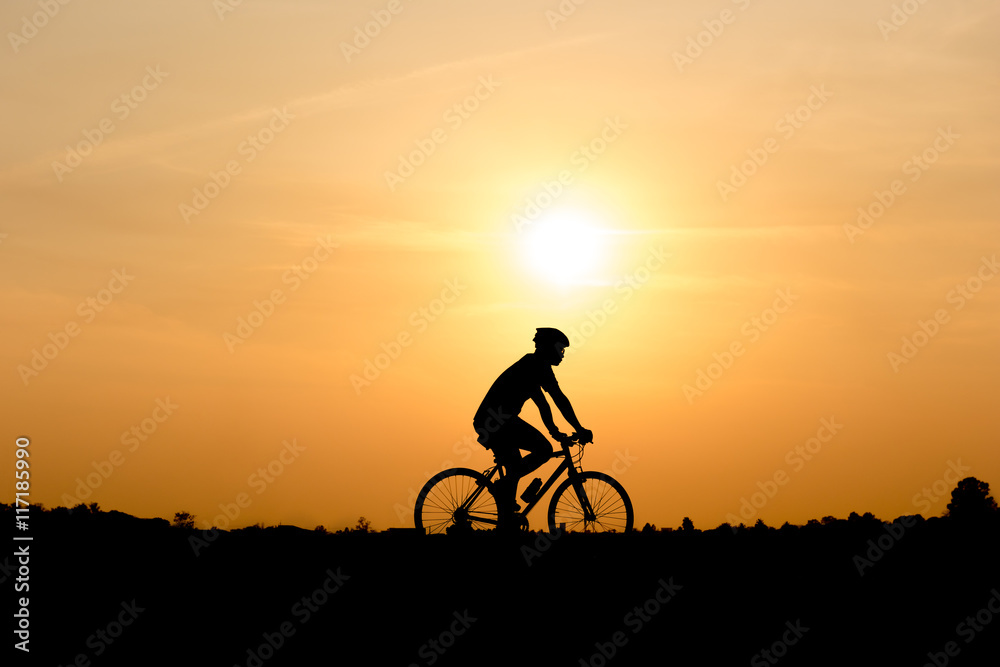 Silhouette of cycling on sunset background Silhouette of cycling on sunset background