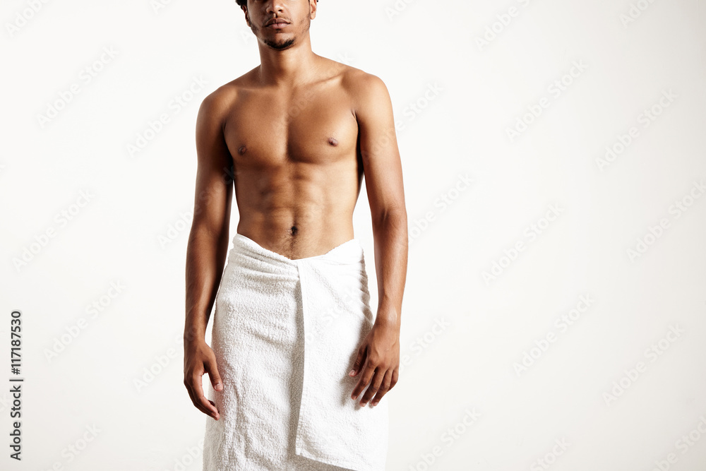 man wears white towel. no face portrait man wears white towel. no face portrait