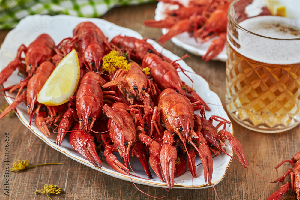 Red boiled crayfish and a glass of beer. Red boiled crayfish and a glass of beer.