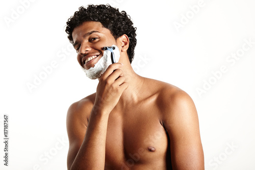 haooy smiling man is shaving