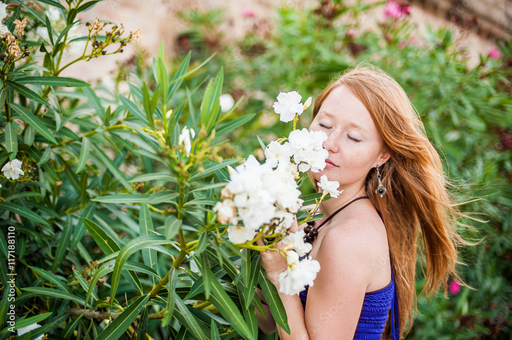 The girl and tropical flowers