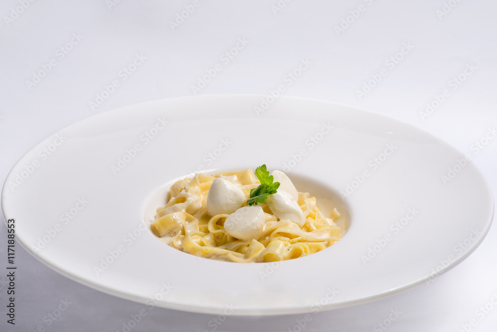 pasta with cream sauce in white plate. Serving for the restaurant menu pasta with cream sauce in white plate. Serving for the restaurant menu