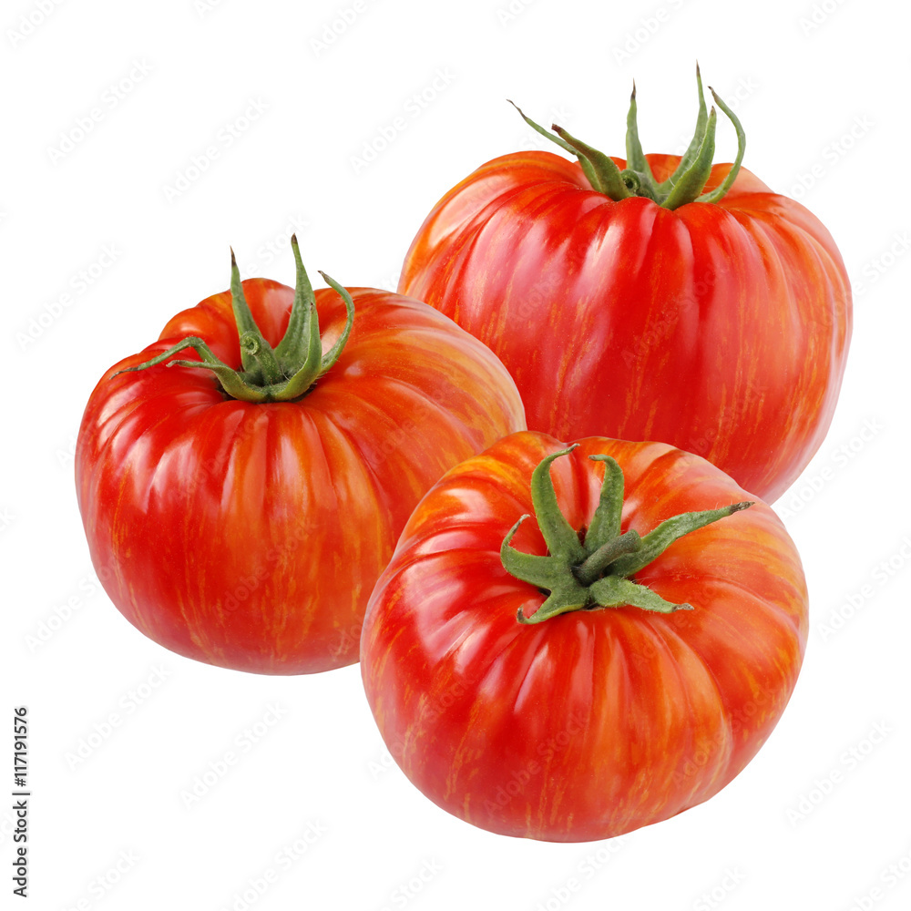 Ripe red tomatoes with orange stripes isolated on white. Ripe red tomatoes with orange stripes isolated on white.