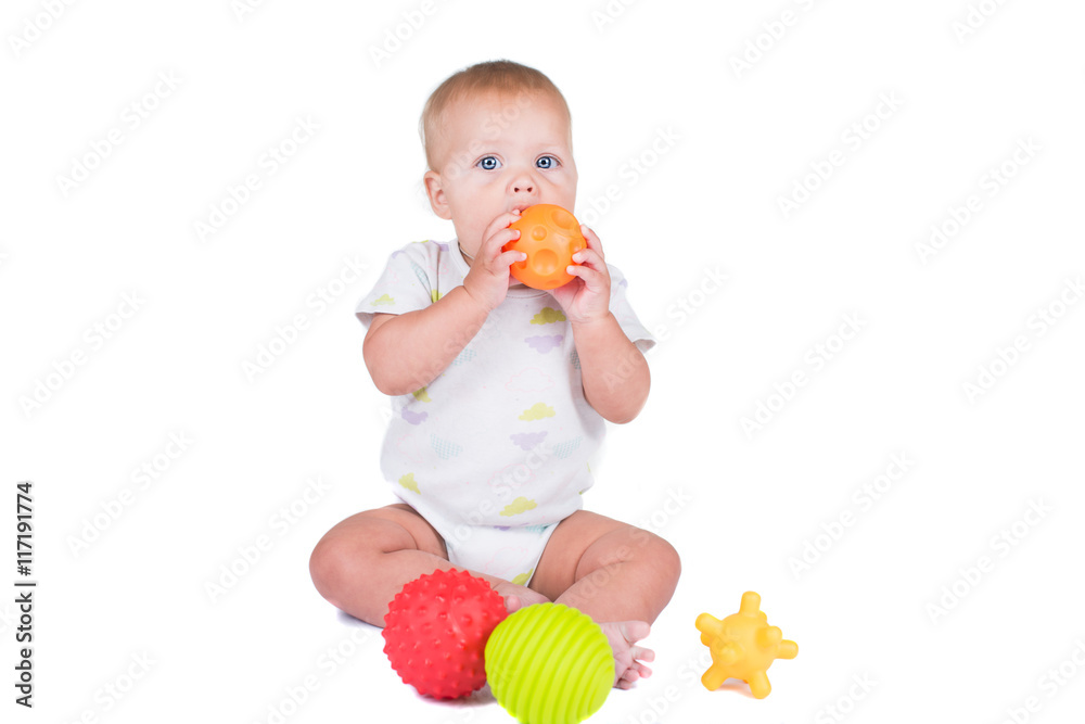 Happy litl baby girl with Thai traditional dress playing with colorful ball on white isolate Happy litl baby girl with Thai traditional dress playing with colorful ball on white isolate