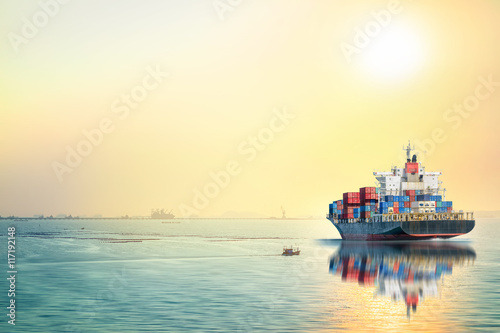 Logistics and transportation of International Container Cargo ship in the ocean at sea sunset time, Freight Transportation, Shipping, Nautical Vessel