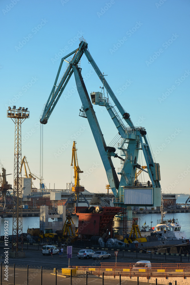 Dockside cranes on a background of blue sky