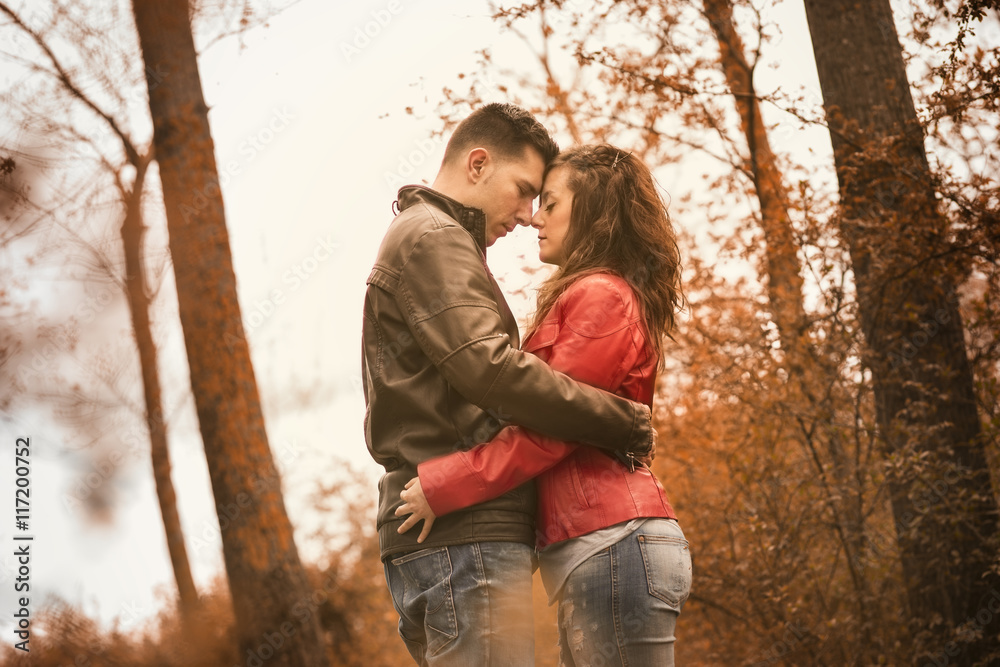 couple kissing outdoor in the park couple kissing outdoor in the park