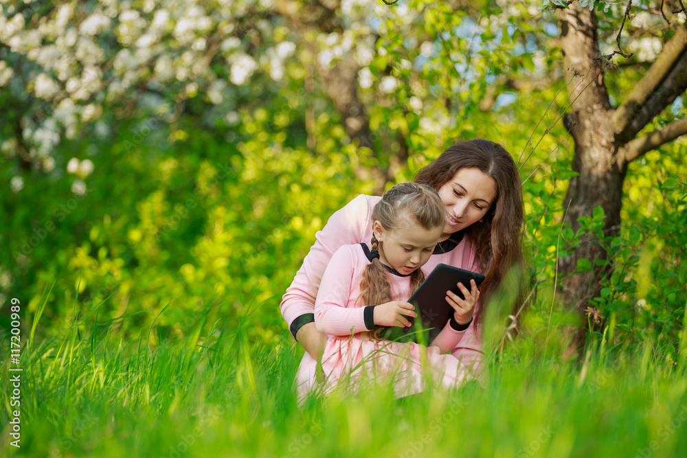 Fototapeta premium Mom and daughter in nature