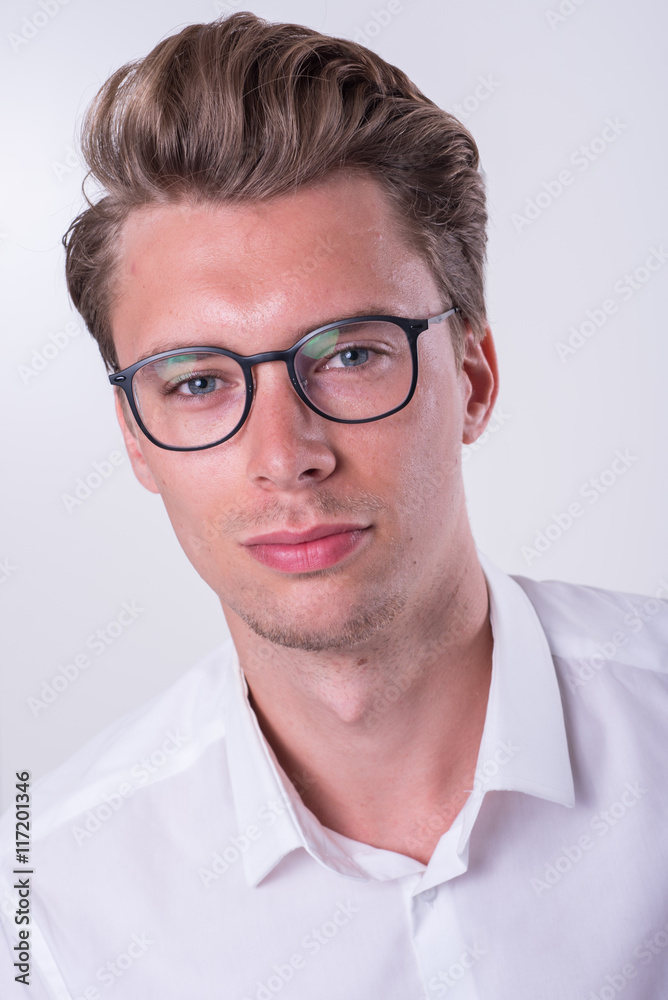 Portrait of a young business man in white shirt