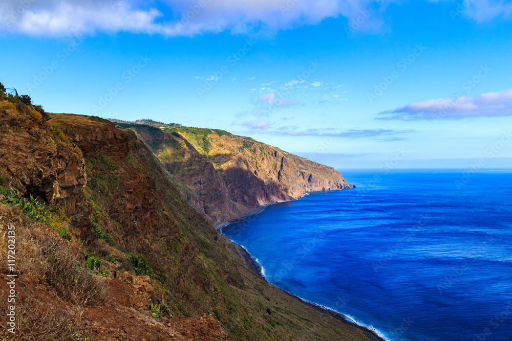 Beautiful Madeira landscape with azure water and green cliffs, Portugal