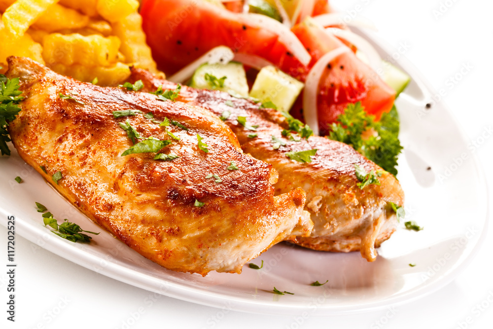 Fried chicken fillet, chips and vegetable salad Fried chicken fillet, chips and vegetable salad