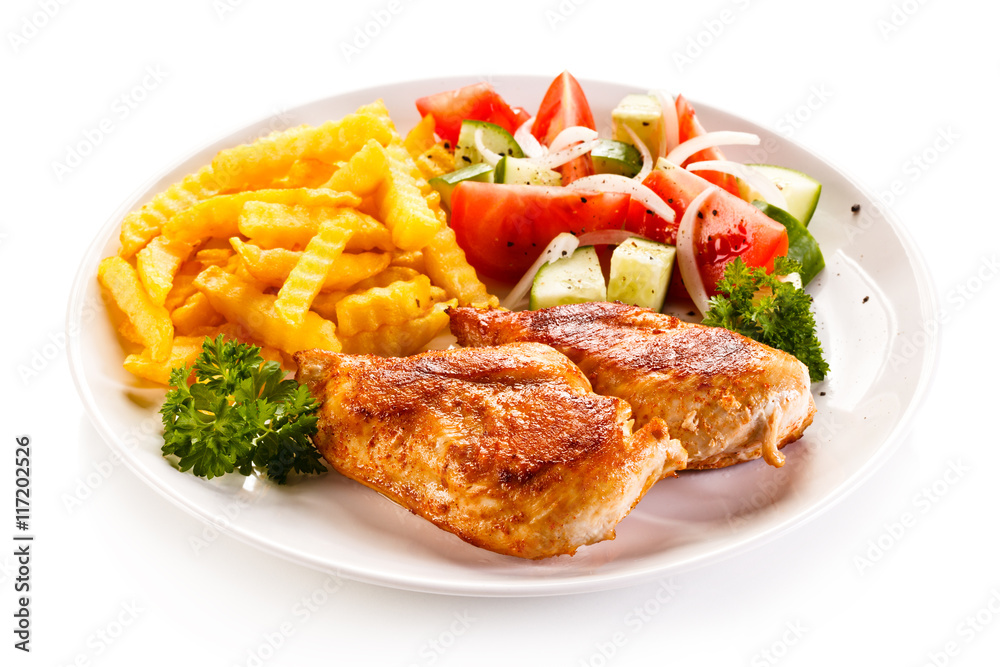 Fried chicken fillet, chips and vegetable salad 