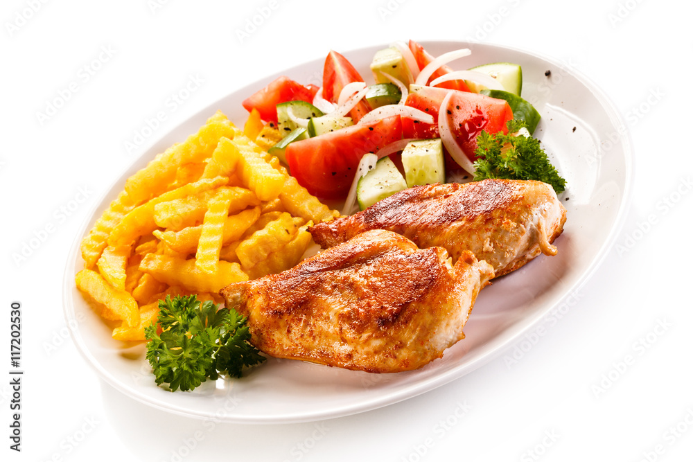 Fried chicken fillet, chips and vegetable salad 