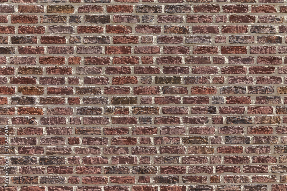 Naklejka premium Typical wall with red bricks.