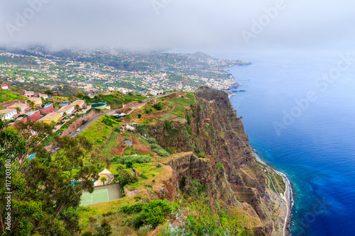Cabo Girao, Madeira. View from the second highest sea cliff in the world towards Funchal on a foggy day photo